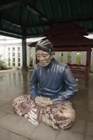Yogyakarta, Indonesia, 2013 - Statue of courtiers from the palace of the Yogyakarta Sultanate photo
