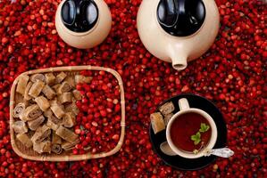 Tea with fresh wild strawberries and pastries photo