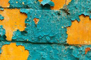 Cracked wall with old layers of paint in abandoned house photo