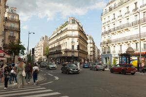 Paris, France 02 June 2018 Streets of the central district of the city of Paris in the summer. Passers-by and tourists with cameras walk around the city. photo