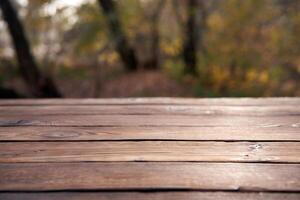 Empty wooden table nature bokeh background with a country outdoor theme,Template mock up for display of product photo