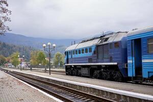 Train stands o platform railway station small provincial town Rural transportation train photo