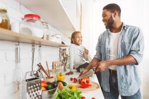 Dad and daughter cooking together photo