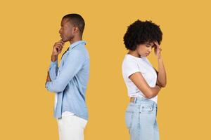 A contemplative young man and a frustrated young woman both deep in thought photo