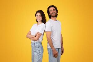 Side-by-side, a confident woman and a beaming man stand back-to-back photo