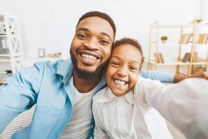 Selfie with dad. Father and little daughter taking photo