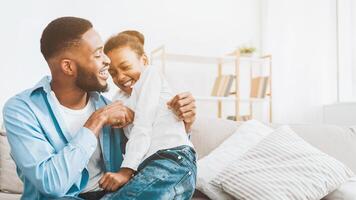 Father and daughter playing together at home photo