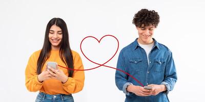 A joyful young woman in a yellow sweater and a man in a denim jacket are texting on their phones photo