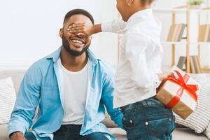 Present For Father. Child Girl Making Surprise For Dad photo