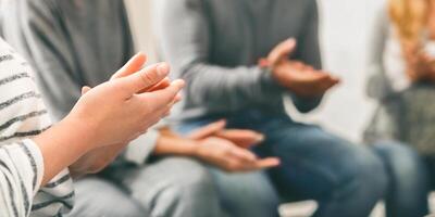 Patients clapping hands at psychotherapy session, close up photo