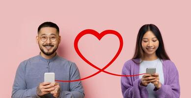 A content man in a gray shirt and glasses holds a smartphone, facing a smiling woman photo