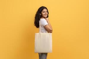 Casual woman with reusable shopping tote bag photo