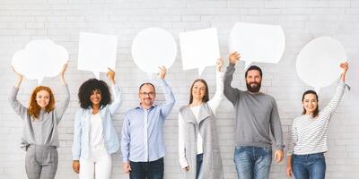 Diverse people holding empty speech bubbles above their heads, free space photo