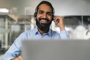 Businessman adjusting headset photo