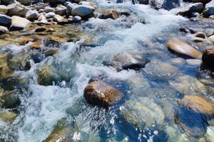 AI generated Stormy river with strong current, washing large stones photo