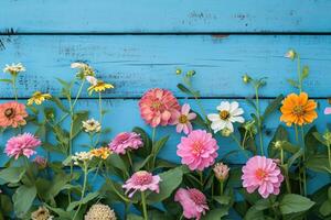 AI generated Garden flowers over blue wooden table background. Backdrop with copy space photo