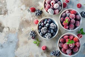 AI generated Frozen berries in small bowls on concrete background. photo