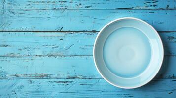 AI generated wooden background  Empty plate on blue wooden background. Top view with copy space photo