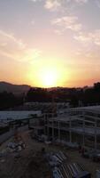 Vertical Video of Construction Crane at Sunset Aerial View