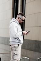 Man texting on phone. photo