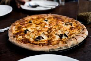 Hot pizza lunch or dinner crust mushroom topping, delicious tasty fast food. photo