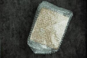 Cardboard box covered with bubble wrap packaging protection photo