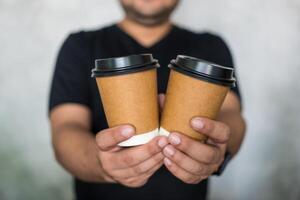 Two brown disposable coffee cups. photo