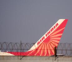 New Delhi, India, December 25 2023 - Air India Airbus A320 take off from Indra Gandhi International Airport Delhi, Air India domestic aeroplane flying in the blue sky during day time photo