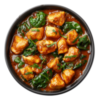 ai generato speziato pollo tikka masala con spinaci nel un' nero ciotola su trasparente sfondo - azione png. png