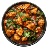 ai generato speziato pollo tikka masala con spinaci nel un' nero ciotola su trasparente sfondo - azione png. png