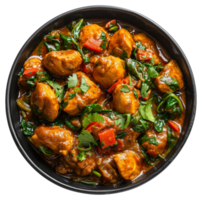 AI generated Spicy chicken tikka masala with spinach in a black bowl on transparent background - stock png. png