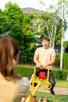 Asian couple love play seesaw photo