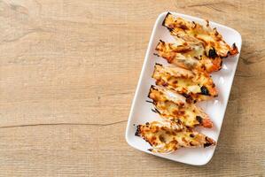 grilled river prawns or shrimps with cheese photo