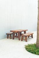 empty wood outdoor patio table and chair set photo