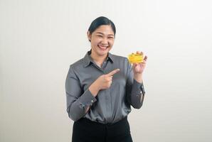 Asian woman holding credit card with white background photo