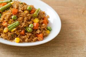 fried rice with green peas, carrot and corn photo