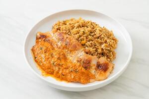 grilled chicken steak with red curry sauce and rice photo
