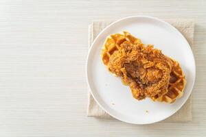 fried chicken waffle with honey or maple syrup photo