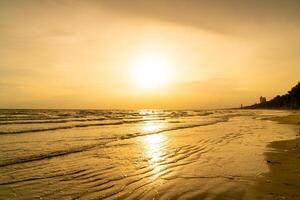 beautiful sea beach with sunset time photo