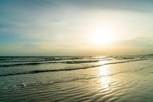 beautiful sea beach with sunset time photo