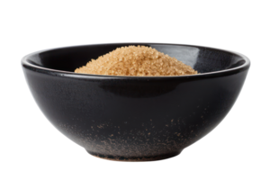 AI generated Organic brown sugar in black bowl on transparent background - stock png. png