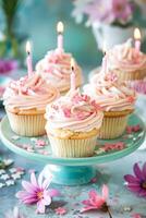 AI generated Delightful Vanilla Cupcakes With Pink Frosting and Lit Candles on a Celebration Table photo