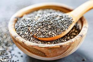 AI generated Wooden Spoon Filled With Chia Seeds photo
