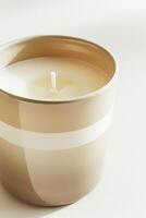 AI generated Serene Candle on a White Windowsill Basking in Soft Morning Light photo
