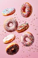 AI generated Assorted Glazed Donuts in Mid-Air Against a Pink Background Captured in Bright Studio Lighting photo