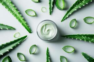 AI generated Fresh Aloe Vera Leaves and Natural Cream on a Bright White Surface photo