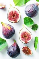 AI generated Fresh Purple Figs Halved and Whole With Green Leaves on White Background photo