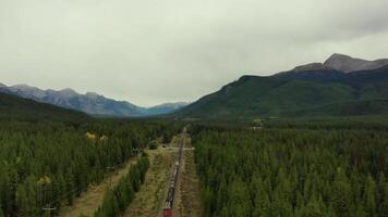 Train tracks crossing the rocky mountains of Canada video