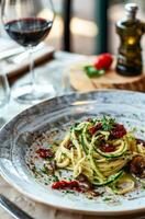 AI generated Gourmet Spaghetti With Mushrooms, Sun-Dried Tomatoes and Herbs Served in a Modern Restaurant photo