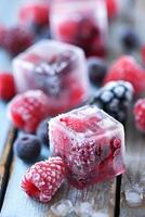 AI generated Frozen Berries Encased in Ice Cubes On A Bright Surface During Daytime photo